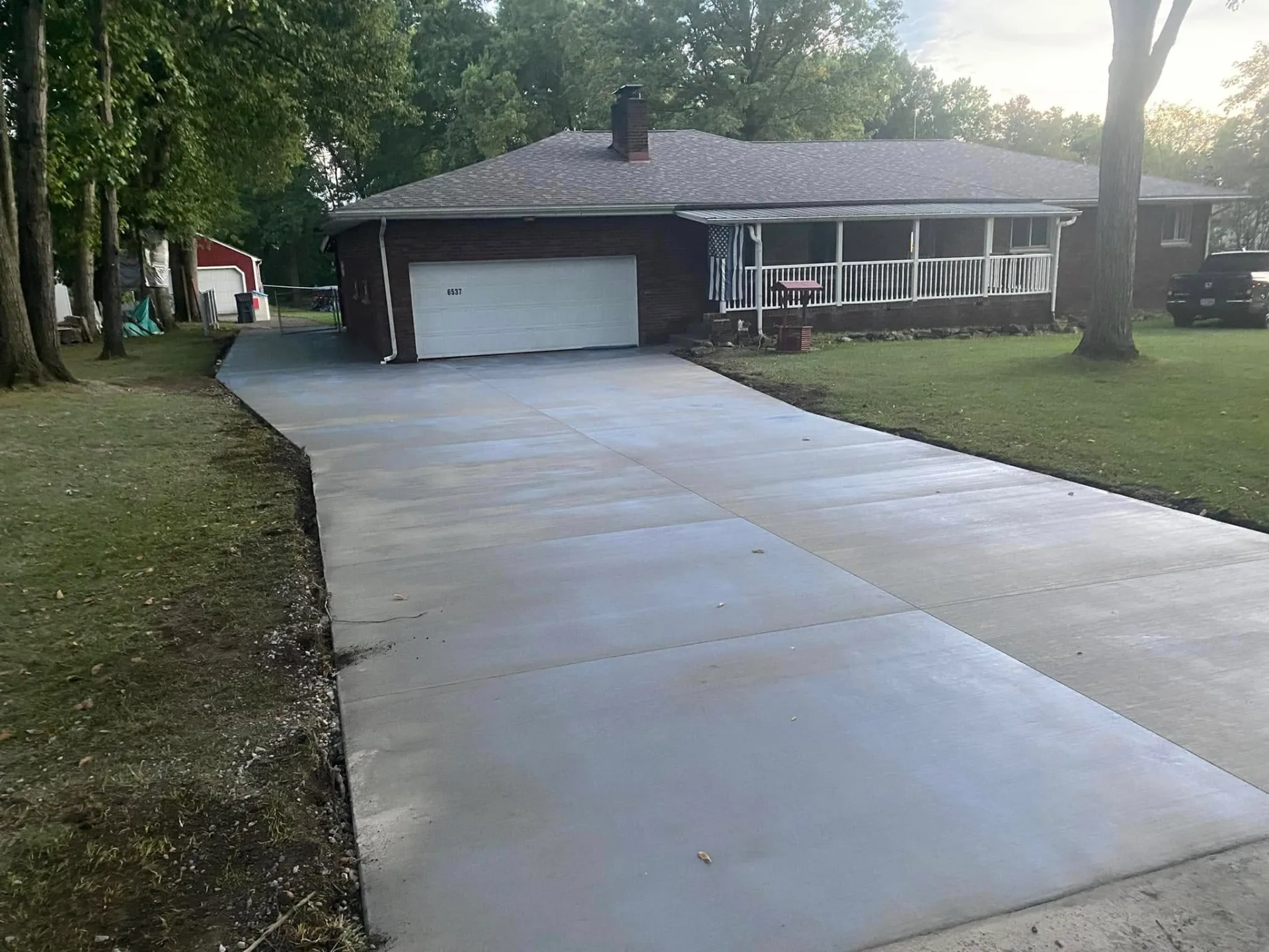 Freshly poured residential concrete driveway by Kondo's Koncrete near Boardman, OH