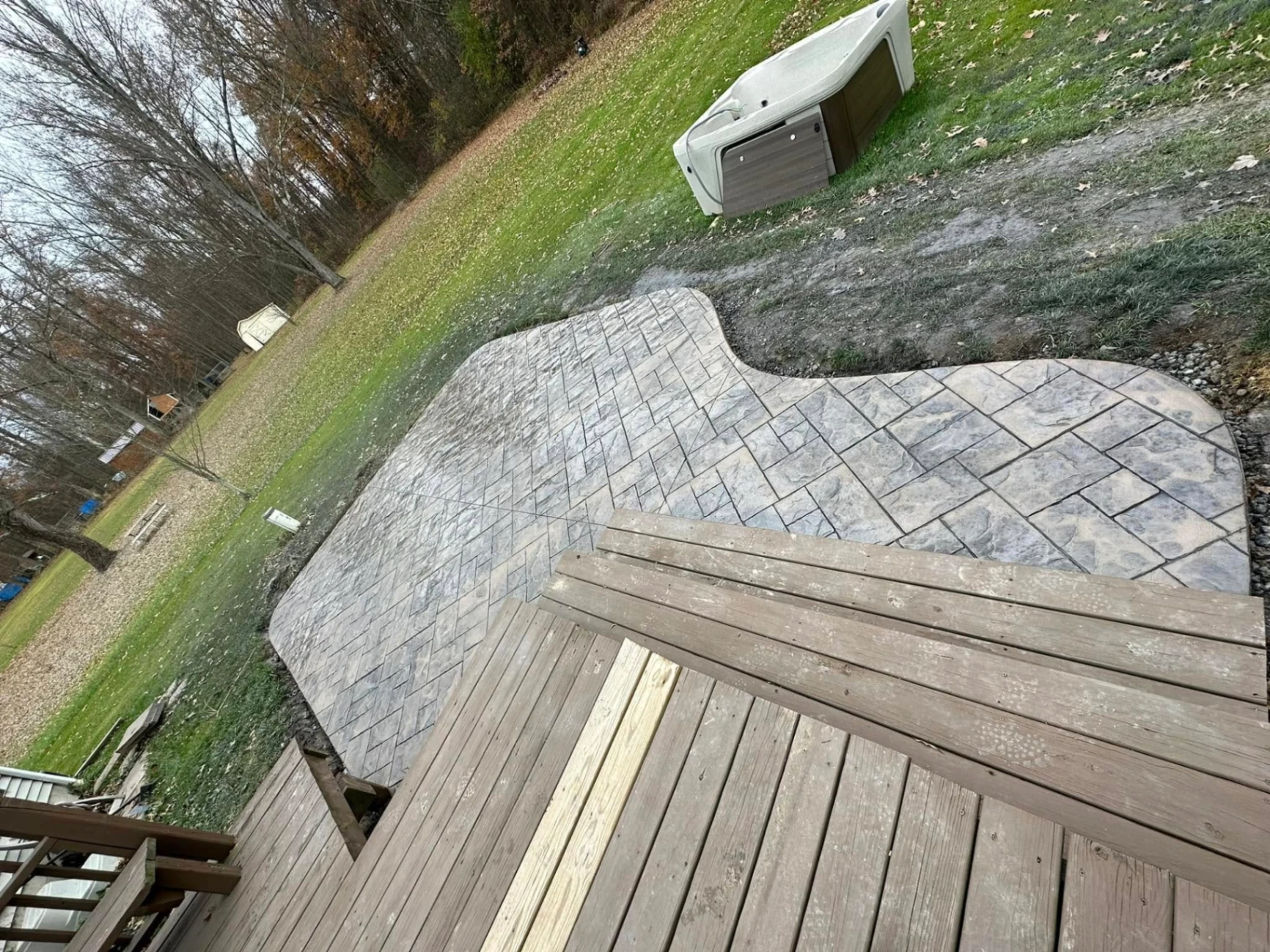 Curved stamped patio off the deck